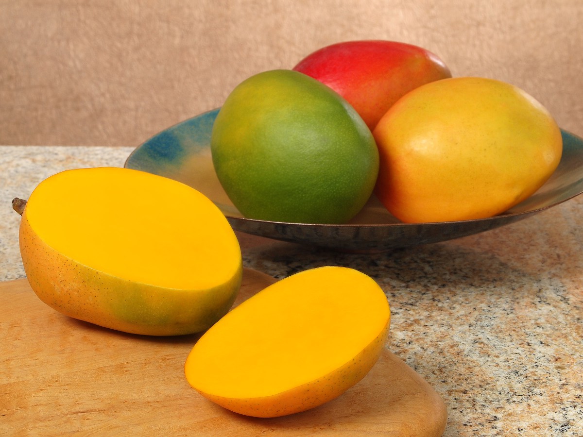 While the skin color of <b>mangoes</b> can vary from green to red, yellow or orang...